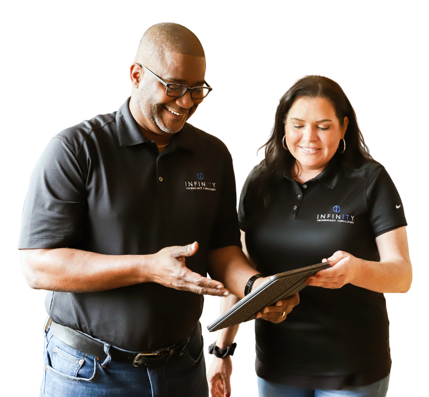 Infinity Tech Consulting professionals in branded polo shirts reviewing tablet device together in office setting GA